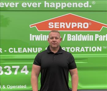 Ben in front of SERVPRO van