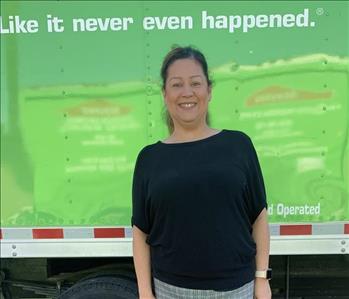 Lisa in front of servpro truck