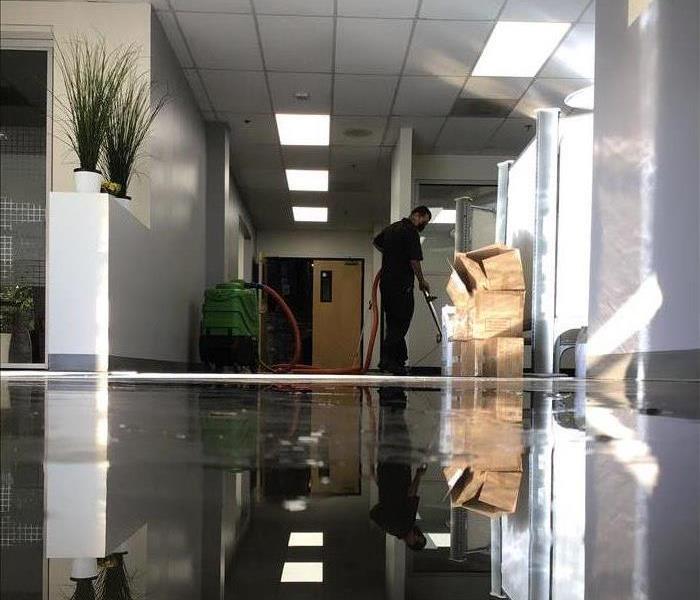 Technician drying carpet